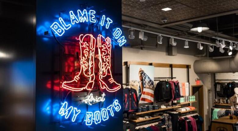 neon sign blame it on my boots